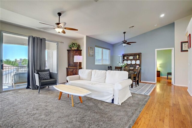 2325 Windmill Pkwy Unit 321, Henderson, NV 89074 - living area with ceiling fan, light wood finished floors, vaulted ceiling, and baseboards