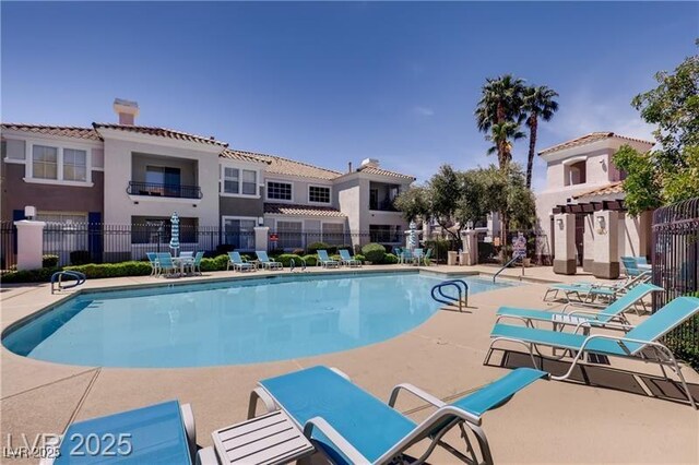2325 Windmill Pkwy Unit 321, Henderson, NV 89074 - community pool featuring a patio area
