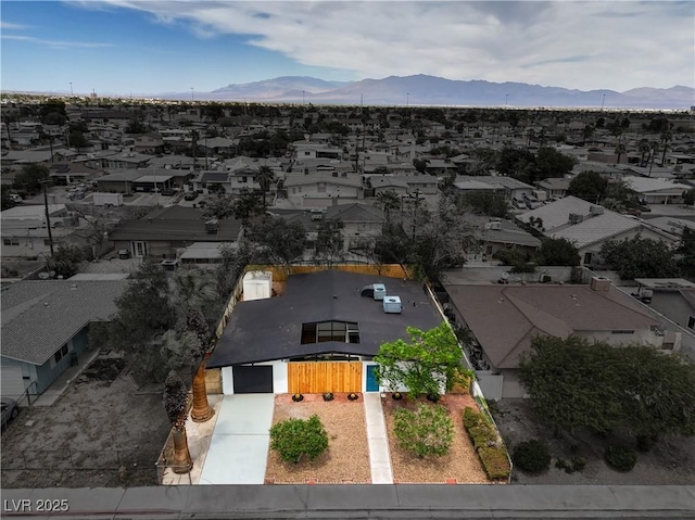 aerial view of residential area featuring mountains