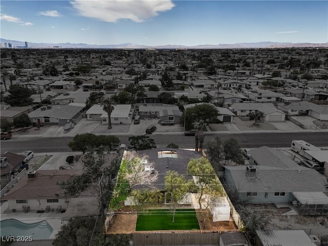 aerial view of residential area with mountains
