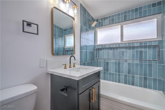 bathroom with toilet, shower / bathtub combination, and vanity