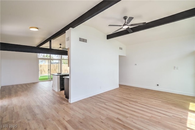unfurnished living room featuring ceiling fan, baseboards, and light wood-style floors