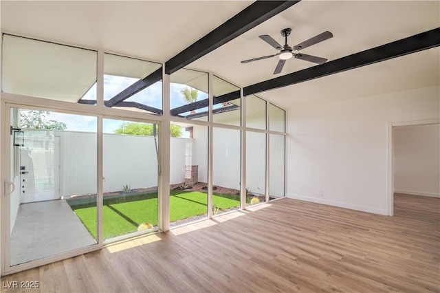 unfurnished sunroom with healthy amount of natural light