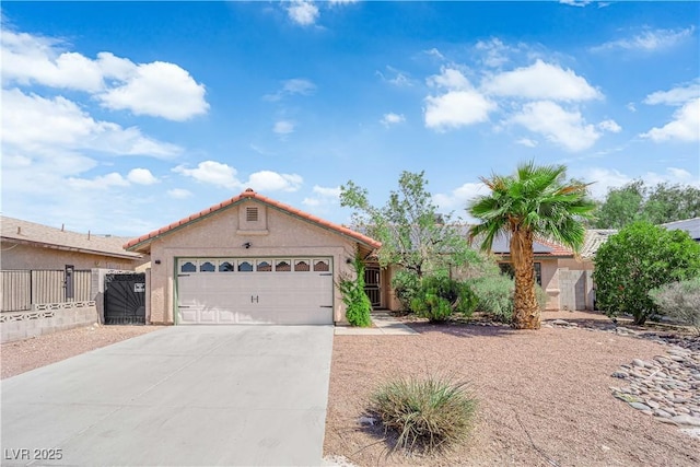 5884 Deer Valley Dr, Las Vegas, NV 89156 - mediterranean / spanish home featuring a garage, driveway, stucco siding, and a tiled roof