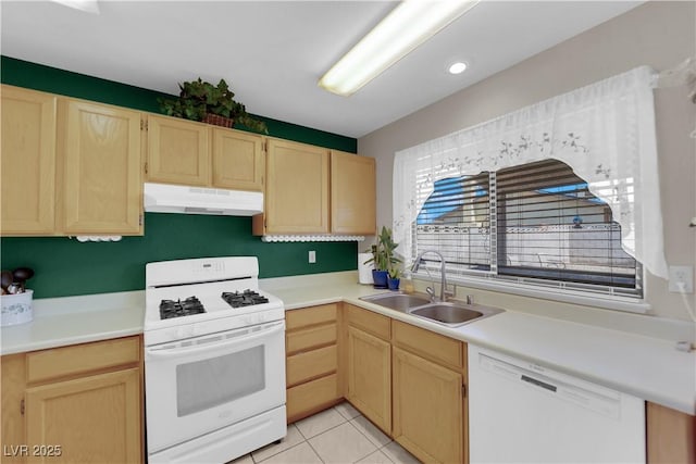 5884 Deer Valley Dr, Las Vegas, NV 89156 - kitchen with white appliances, under cabinet range hood, and light brown cabinetry