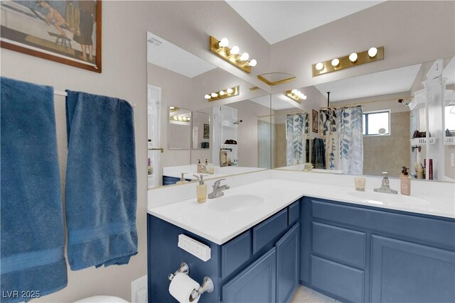 5884 Deer Valley Dr, Las Vegas, NV 89156 - bathroom featuring double vanity and a shower with curtain