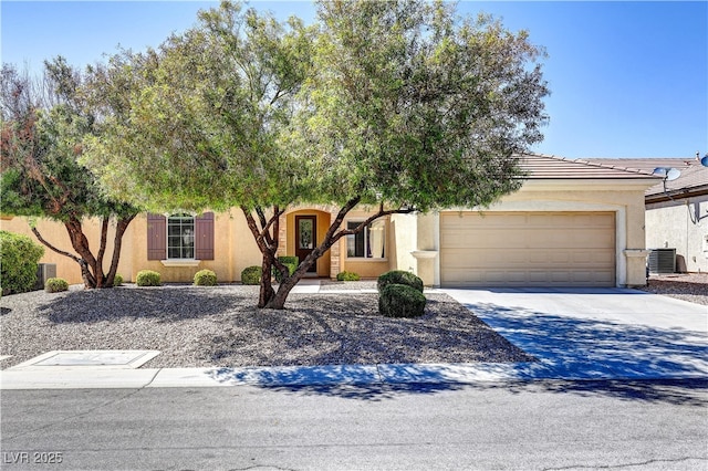 2183 Waterton Rivers Dr, Henderson, NV 89044 - view of front of home with stucco siding, an attached garage, central AC, and driveway
