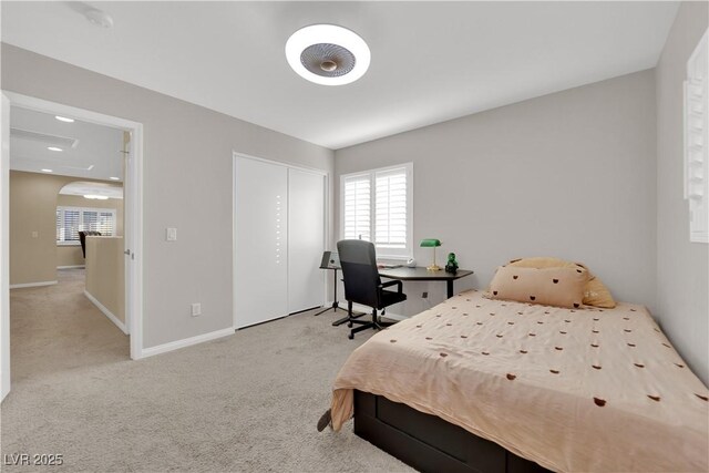 7183 Majestic Bluff Pl, Las Vegas, NV 89113 - bedroom featuring carpet, baseboards, a closet, and arched walkways