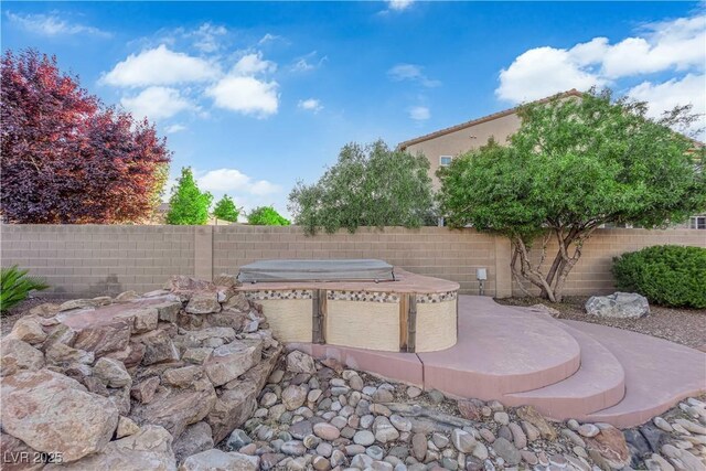 7183 Majestic Bluff Pl, Las Vegas, NV 89113 - view of patio / terrace with a hot tub and a fenced backyard