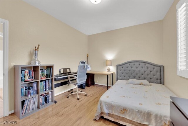 7183 Majestic Bluff Pl, Las Vegas, NV 89113 - bedroom with wood finished floors, baseboards, and a desk