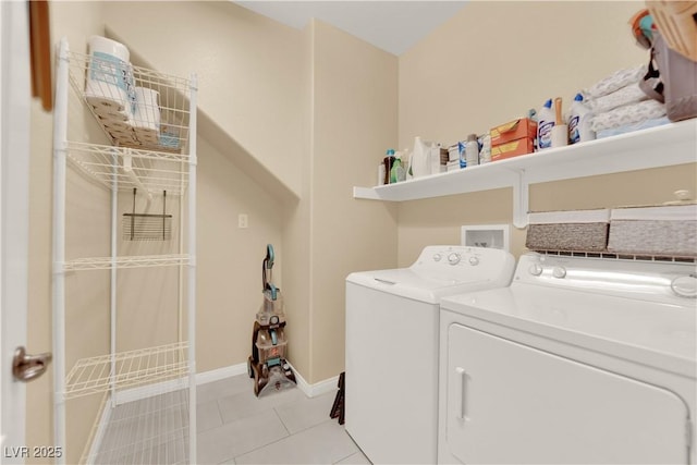 7183 Majestic Bluff Pl, Las Vegas, NV 89113 - washroom featuring washing machine and clothes dryer, light tile patterned flooring, and baseboards