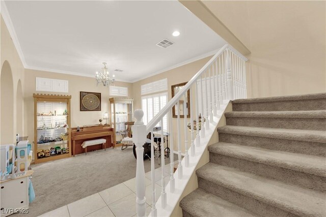 7183 Majestic Bluff Pl, Las Vegas, NV 89113 - stairs featuring carpet flooring, arched walkways, tile patterned floors, ornamental molding, and a chandelier