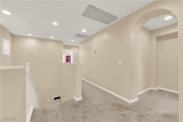 7183 Majestic Bluff Pl, Las Vegas, NV 89113 - empty room with carpet floors, arched walkways, baseboards, and recessed lighting