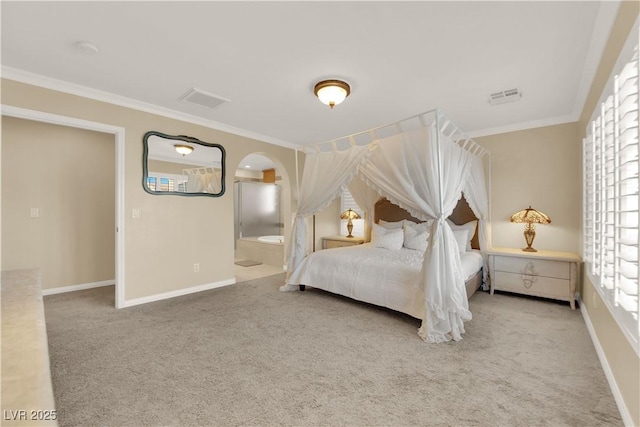 7183 Majestic Bluff Pl, Las Vegas, NV 89113 - carpeted bedroom featuring crown molding, baseboards, ensuite bath, and arched walkways