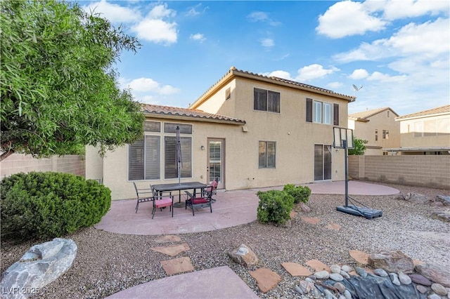 7183 Majestic Bluff Pl, Las Vegas, NV 89113 - rear view of house featuring a fenced backyard, a patio area, stucco siding, and a tile roof