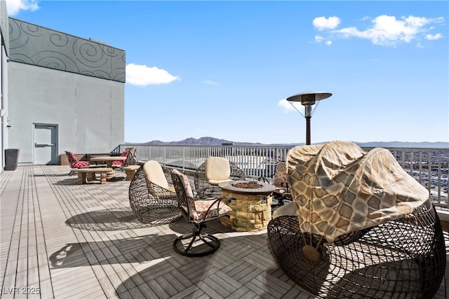 360 E Desert Inn Rd Unit 1901, Las Vegas, NV 89109 - wooden terrace featuring a fire pit and a mountain view