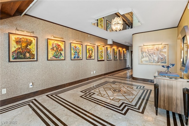 360 E Desert Inn Rd Unit 1901, Las Vegas, NV 89109 - hallway with inlaid floor details, a chandelier, and baseboards