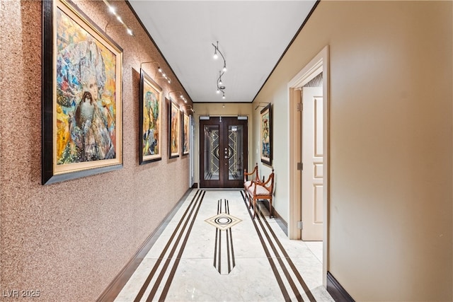 360 E Desert Inn Rd Unit 1901, Las Vegas, NV 89109 - hallway featuring inlaid floor details, baseboards, and french doors