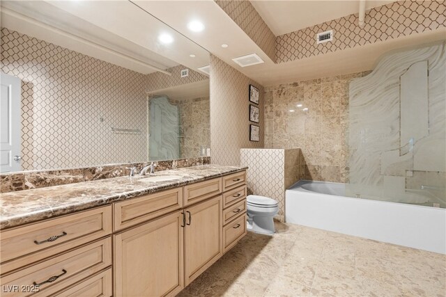 360 E Desert Inn Rd Unit 1901, Las Vegas, NV 89109 - bathroom featuring toilet, a bath, vanity, and tile patterned flooring