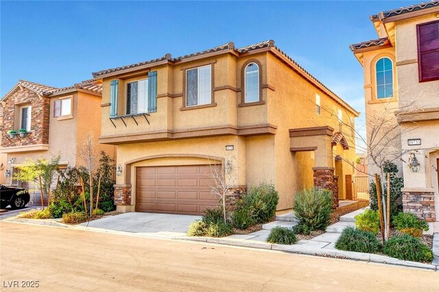 10735 Galveston Bay St, Las Vegas, NV 89179 - view of front of home featuring an attached garage, stucco siding, concrete driveway, and stone siding
