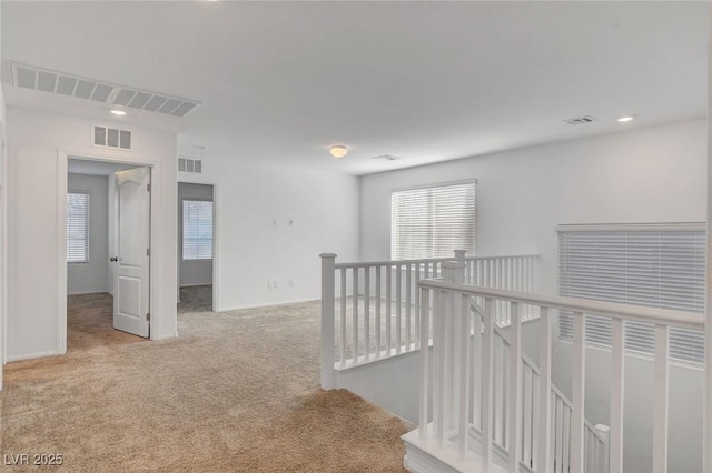 10735 Galveston Bay St, Las Vegas, NV 89179 - hall with an upstairs landing, plenty of natural light, carpet flooring, recessed lighting, and baseboards