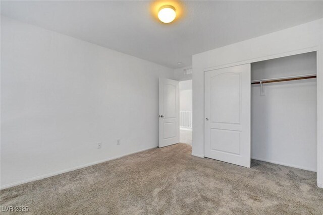 10735 Galveston Bay St, Las Vegas, NV 89179 - unfurnished bedroom featuring carpet flooring, a closet, and baseboards