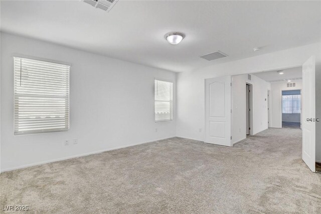 10735 Galveston Bay St, Las Vegas, NV 89179 - unfurnished room featuring light carpet and baseboards