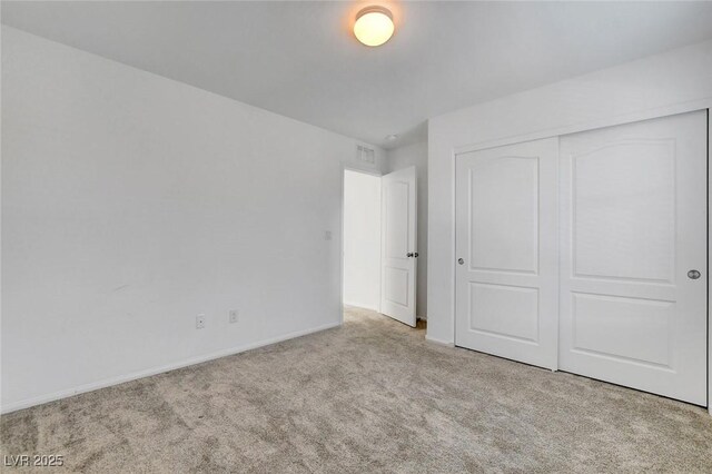 10735 Galveston Bay St, Las Vegas, NV 89179 - unfurnished bedroom with carpet floors, a closet, and baseboards