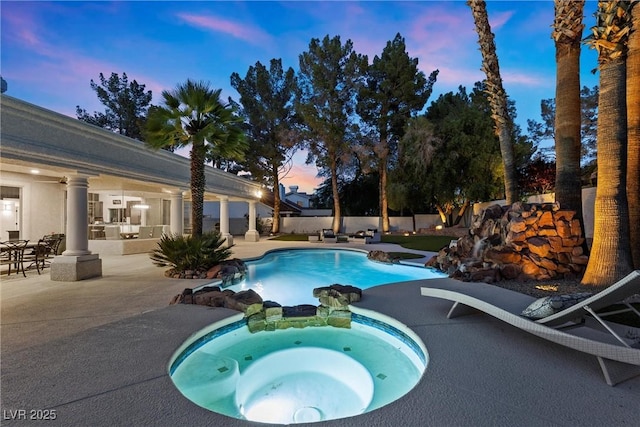 2268 Buckingham Ct, Henderson, NV 89074 - pool at dusk with a patio and a pool with connected hot tub