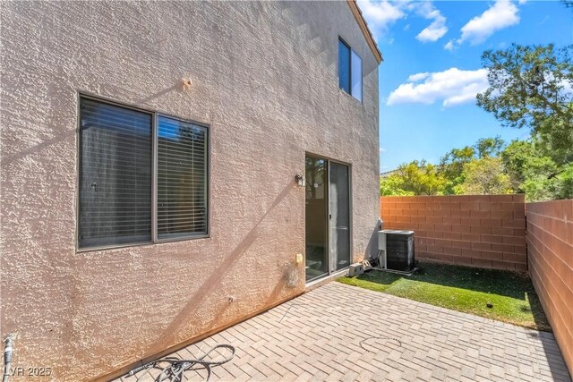 9753 Villa Lorena Ave, Las Vegas, NV 89147 - view of patio / terrace with central AC unit and fence