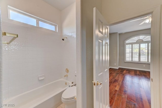 7540 Crystal Cave Dr, Las Vegas, NV 89117 - bathroom featuring toilet, wood-type flooring, tub / shower combination, and baseboards