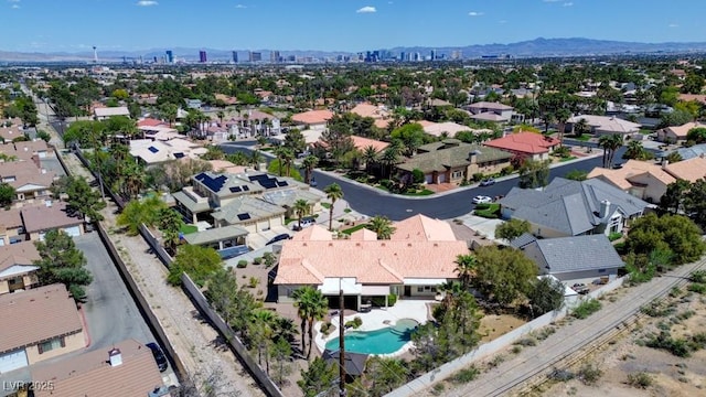 7540 Crystal Cave Dr, Las Vegas, NV 89117 - aerial perspective of suburban area with a pool area and a mountainous background