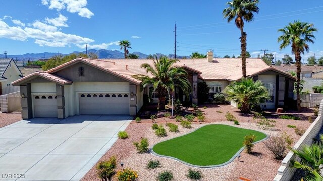 7540 Crystal Cave Dr, Las Vegas, NV 89117 - ranch-style home with a garage, a mountain view, a tiled roof, stucco siding, and driveway