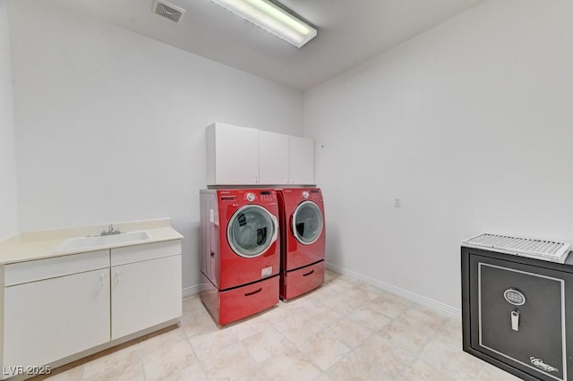 7540 Crystal Cave Dr, Las Vegas, NV 89117 - laundry area with independent washer and dryer and cabinet space
