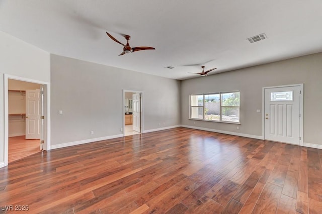 7540 Crystal Cave Dr, Las Vegas, NV 89117 - unfurnished living room with ceiling fan, wood finished floors, and baseboards
