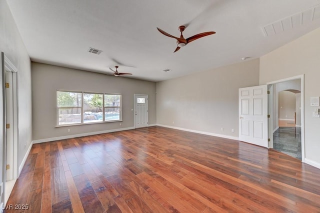 7540 Crystal Cave Dr, Las Vegas, NV 89117 - spare room featuring ceiling fan, arched walkways, wood-type flooring, and baseboards