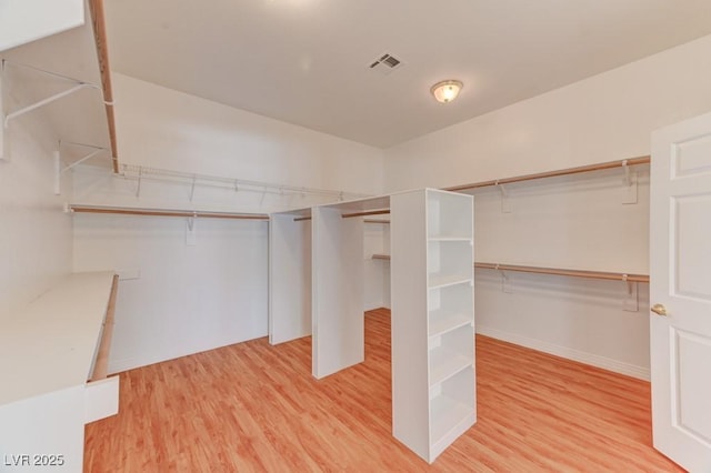 7540 Crystal Cave Dr, Las Vegas, NV 89117 - walk in closet featuring wood finished floors