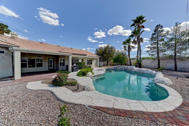 7540 Crystal Cave Dr, Las Vegas, NV 89117 - view of swimming pool featuring ceiling fan, a fenced backyard, and a patio