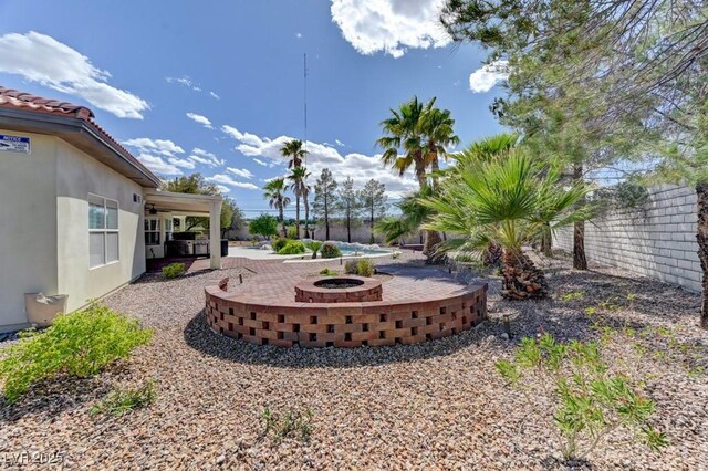 7540 Crystal Cave Dr, Las Vegas, NV 89117 - view of yard featuring a patio area and an outdoor fire pit