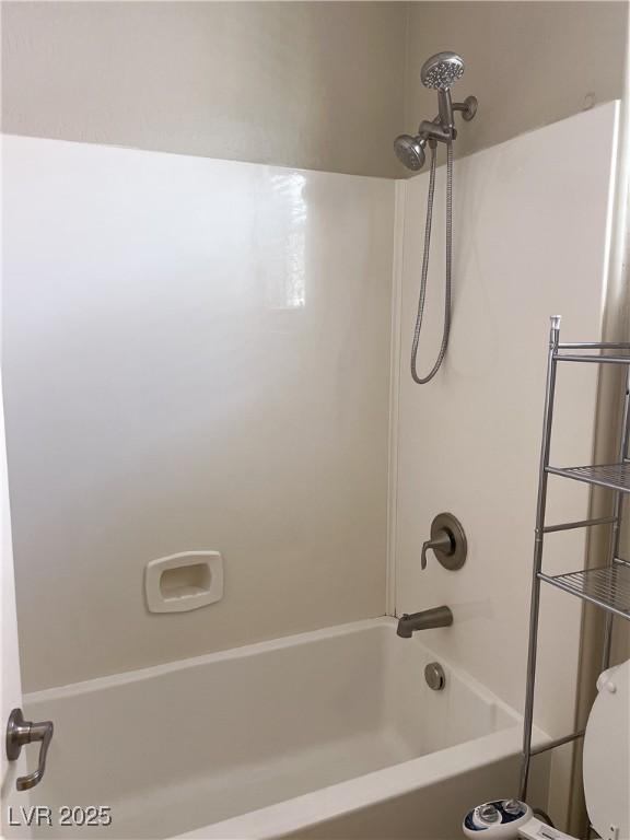 full bath featuring bathtub / shower combination and toilet