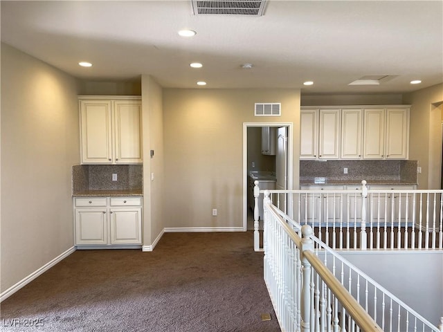 kitchen with dark carpet, backsplash, recessed lighting, and baseboards