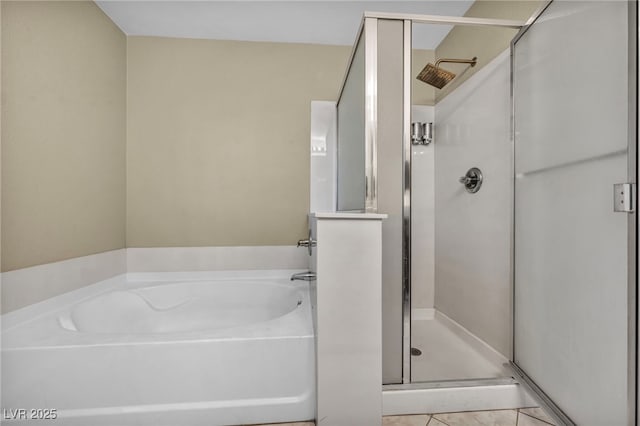 full bathroom with a bath and a stall shower