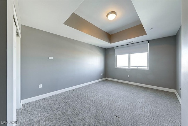 150 Las Vegas Blvd Unit 2016, North Las Vegas, NV 89101 - unfurnished room featuring a tray ceiling, carpet floors, and baseboards