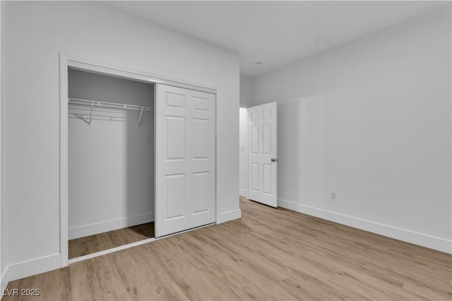 10801 Clarion Ln, Las Vegas, NV 89134 - unfurnished bedroom featuring wood finished floors, baseboards, and a closet