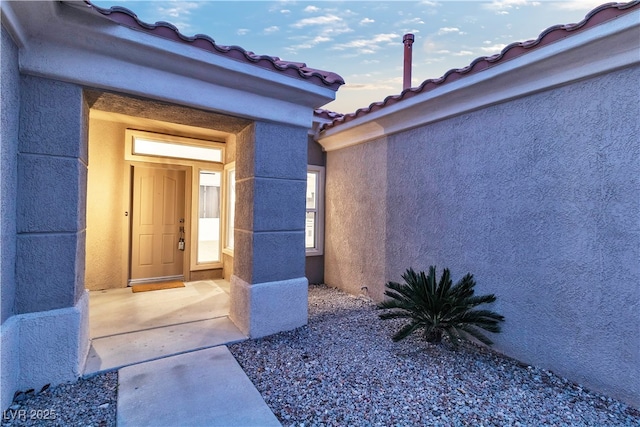 10801 Clarion Ln, Las Vegas, NV 89134 - doorway to property featuring a tiled roof and stucco siding