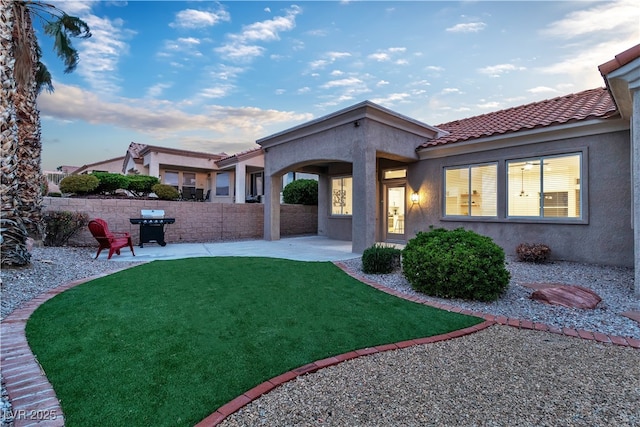 10801 Clarion Ln, Las Vegas, NV 89134 - back of property featuring stucco siding, a patio, and a tiled roof