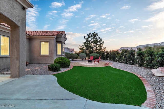 10801 Clarion Ln, Las Vegas, NV 89134 - view of green lawn featuring a patio area and a fire pit
