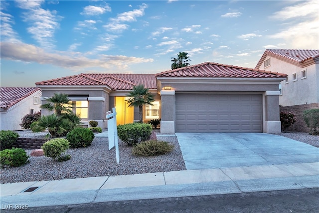 10801 Clarion Ln, Las Vegas, NV 89134 - mediterranean / spanish-style house featuring an attached garage, driveway, stucco siding, and a tiled roof