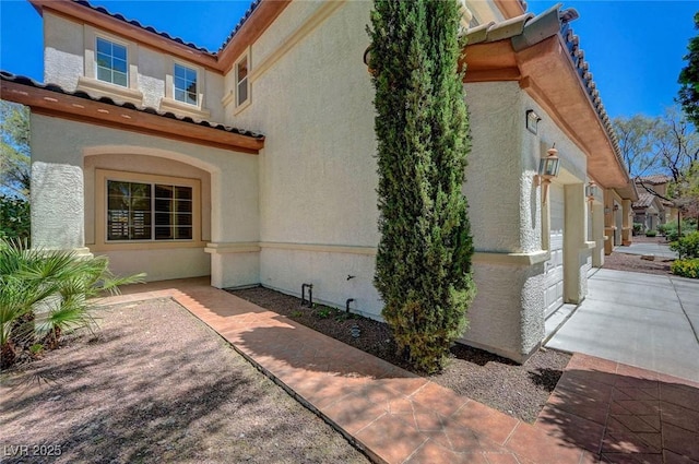 11444 Steponia Bay St, Las Vegas, NV 89141 - view of property exterior featuring stucco siding and a tile roof