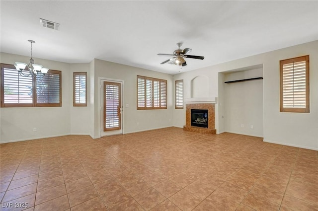 11444 Steponia Bay St, Las Vegas, NV 89141 - unfurnished living room with ceiling fan, a chandelier, a glass covered fireplace, and baseboards